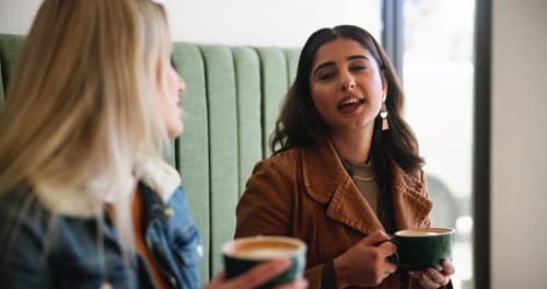 Women, friends and conversation with coffee in cafe for bonding together, happy reunion and support