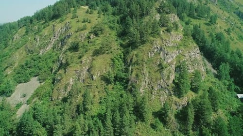 Aerial View of Green Mountain with Rocks Formations and Trees