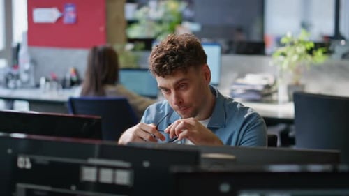 Office Manager Feeling Tired Looking Computer at Corporate Workplace Closeup