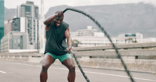 Man, battle ropes and exercise in city for speed workout or health performance for muscle