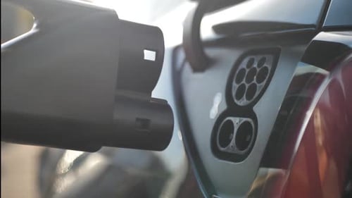 Electric Car Charging in the Sunlight, Close Up