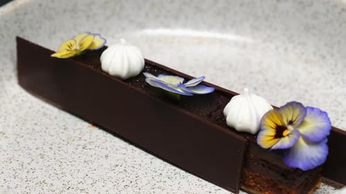 Elegant Chocolate Dessert With Flowers and Meringue