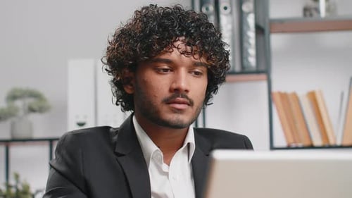 Closeup Businessman Freelancer at Office Workplace Working on Laptop Computer Sends Online Messages