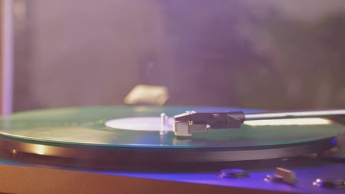 Green Vinyl Record Spinning on Turntable