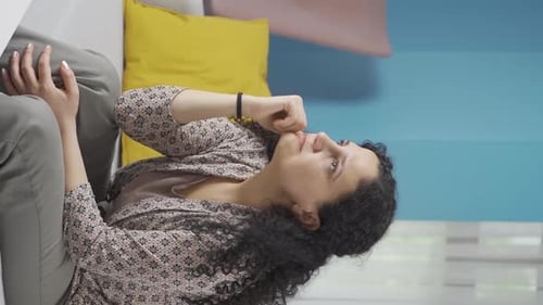 Upset Woman Sitting Next to Someone on Couch