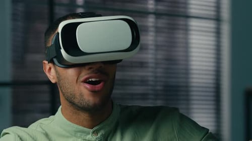 Young Adult Surprised While Using VR Headset