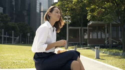 Young Businesswoman Lunch Break in City