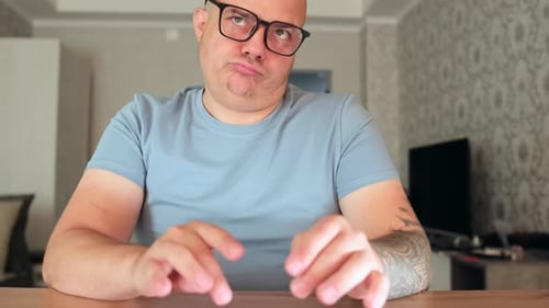 Man Types on Wireless Keyboard at Desk