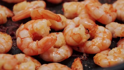 A Closeup of Panfried Shrimp Large Shrimp are Fried in Oil