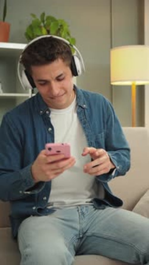 Young Man Listening to Music on Phone