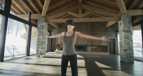 Woman Uses VR Headset in Luxurious Mountain Home