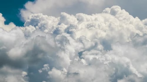 Timelapse of White Puffy Cumulus Clouds Forming on Summer Blue Sky