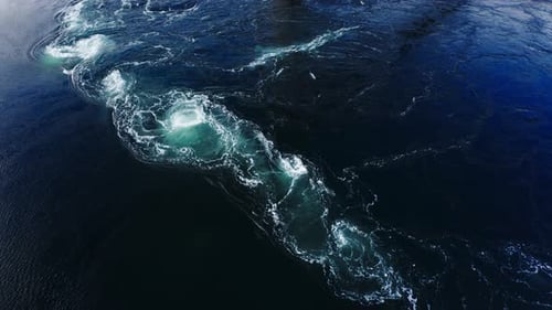 Waves of Water of the River and the Sea Meet Each Other During High Tide and Low Tide