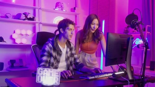Man and Woman Gaming Together at Home