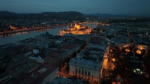 Aerial view of the illuminated Hungarian Parliament Building and the Danube river, Budapest, Hungary