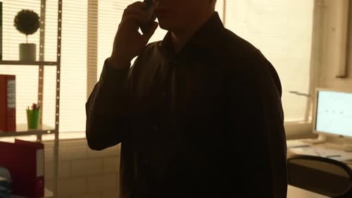 Young Adult Making a Phone Call in Office