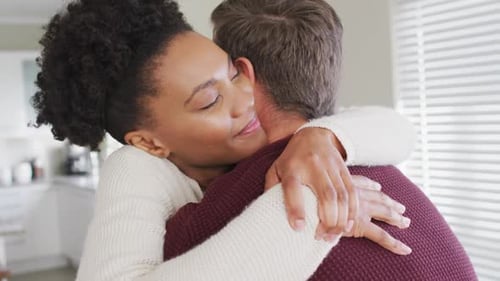 Loving Woman Embraces Partner Indoors