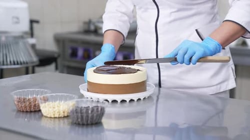 Pastry chef cooking sweet dessert. Delicious cakes making in bakery.