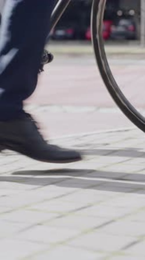 Legs, walking or businessman in city with bike, urban travel or sustainable commute in morning trip