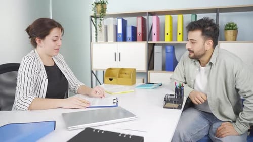 Business Meeting with Man Signing Contract in Office