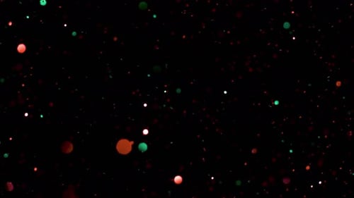 Modische abstrakte Glitzerpartikel auf schwarzem Hintergrund