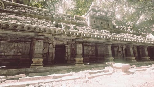 Ancient Temple Ruins in Cambodia Surrounded By Lush Greenery During Daylight