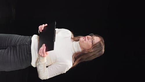 Business Consultant Gesturing OK Sign Over Black Background