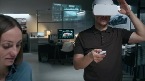 Male Automotive Engineer in VR Headset Drawing New Car Model