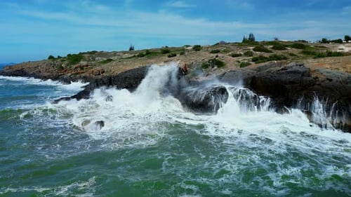 Large Ocean Beautiful Wave Aerial Slow Motion View of Waves Breaking Against Rocks on a Rocky