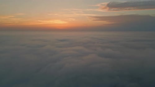 Orange Cloudy Sky Horizon Aerial View Golden Skyline Over White Fluffy Clouds