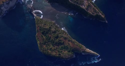 drone flying forward high above the atuh beach on the nusa penida island