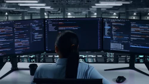 Back View Of Asian Woman Developer Having Backache While Write Code In Data Center