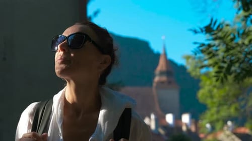 A Tourist Enjoys Medieval Architecture in an Old European City