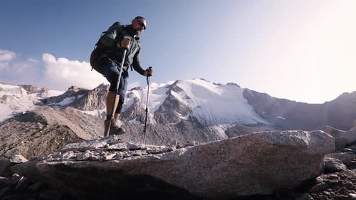 Hiker Tourist with Backpack at Mountain Valley