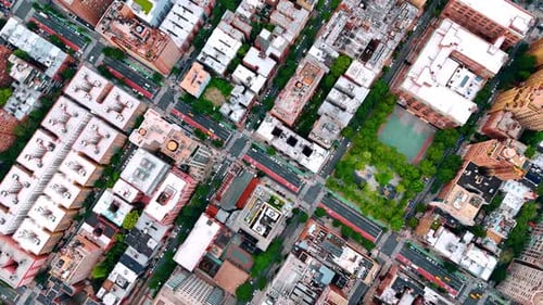 Flying over the multi-lane road crossing the urban landscape of a vibrant metropolis.