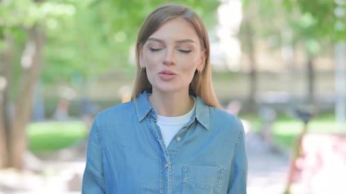 Webcam View of Talking Young Woman Doing Video Chat