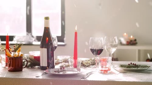 Celebratory holiday table setting with wine and candles