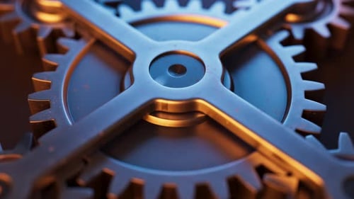Loop-Animation einer mechanischen Struktur aus Metallzahnrädern.