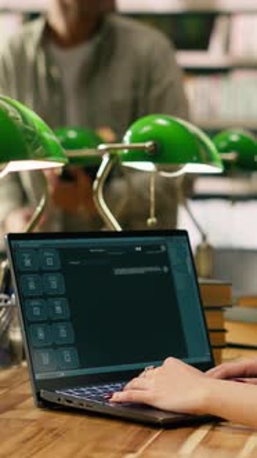 Vertical Video Student Using AI Study Assistant Interface Typing on Laptop at Library Table