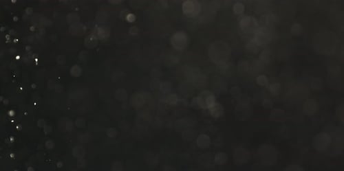 Echte Staubpartikel, die in der Luft schweben