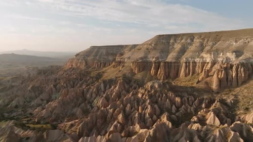 Cappadocia, Turkiye Valleys Bathed in Golden Light A Terracotta Panorama