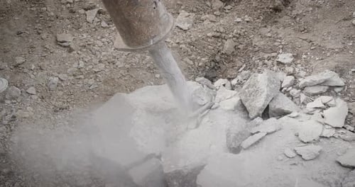 Jackhammer digging up side walk 120fps