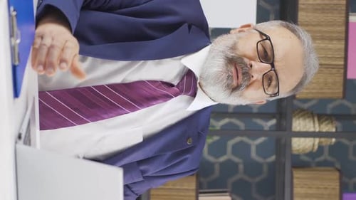 Man in Suit Working at Computer in Office