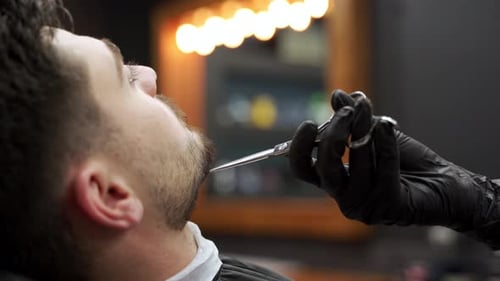 Beard Trim Close-up in Modern Barber Shop