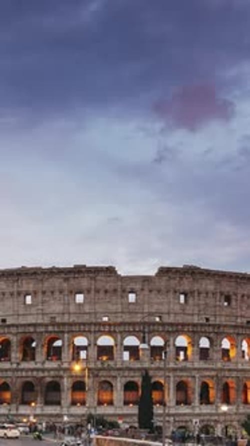 Rome Italy Colosseum Vertical Footage Video Traffic Near Flavian Amphitheatre During Sunset Evening