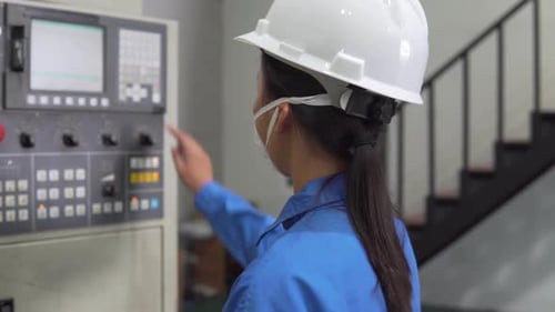 Footage B-roll of Group factory worker technician check a machine.