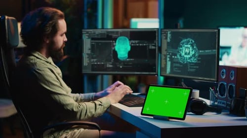 Developer Using Green Screen Tablet Updating Artificial Intelligence