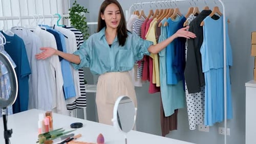 Woman Filming Fashion Content in Bright Studio Apartment