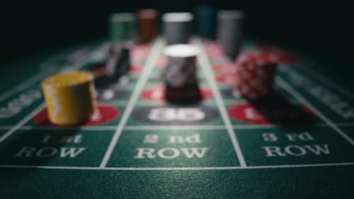 Close Up of Bet Stacks of Chips on a Green Casino Roulette Table