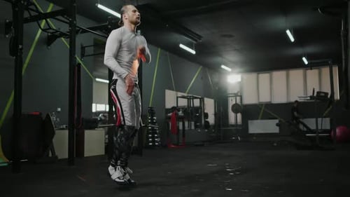 Athletic Muscular Young Boxer Shirtless with Jumping Rope Ready to Jump Slow Motion
